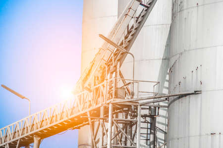 Close up Industrial view at oil refinery plant form industry zone with blue sky and sunrise sky backgroundの写真素材