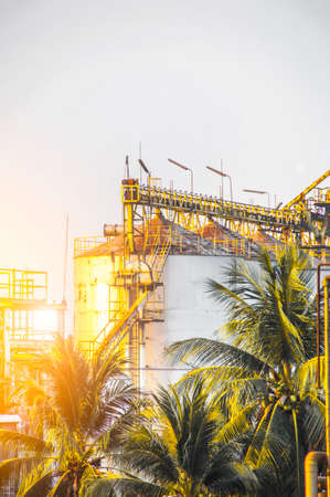 Industrial view at oil refinery plant form industry zone with sunrise sky backgroundの写真素材