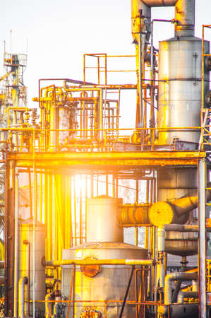 Close up Industrial view of pipelines and valves  at oil refinery plant form industry zone with sunrise sky backgroundの写真素材