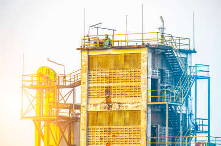 Close up Industrial view at oil refinery plant form industry zone with sunrise sky background ,blue toneの写真素材