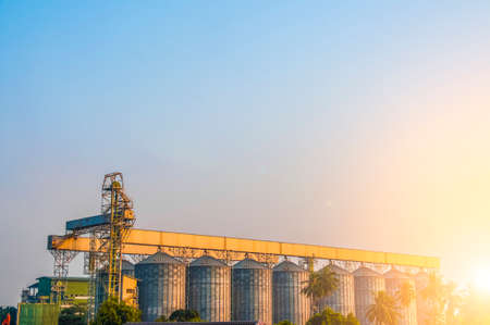 Industrial view at oil refinery plant form industry zone with blue sky and sunrise sky backgroundの写真素材