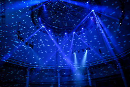 Stage Spotlight and blue Laser rays with black backgroundの写真素材