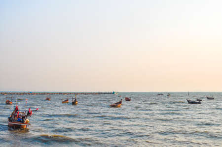 fishing boats in the bay with white sky backgroundの写真素材