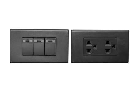 Close up black electic plug and switch  isolated on white background with clipping path.の写真素材