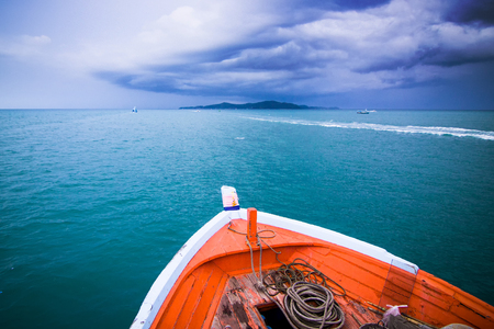 Travel to the island by boat a storm is coming.の写真素材