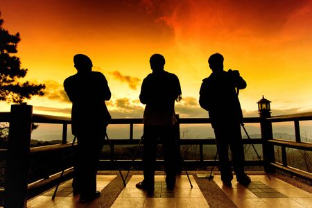 Silhouette of photographers in eveningの写真素材