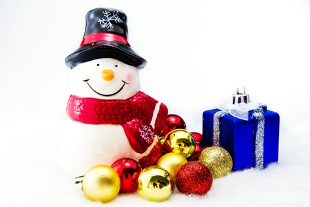 Snow man with gifts on white background.の写真素材