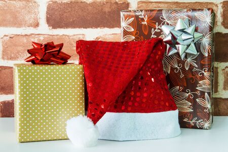 Gift box with a red Santa hatの写真素材