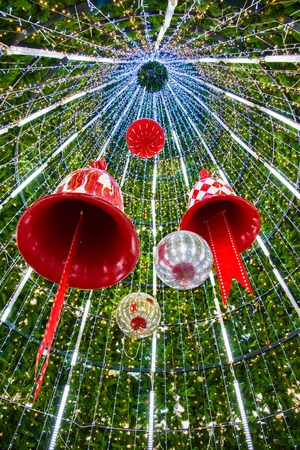 Christmas Bell and sparkles ball in a Christmas treeの写真素材