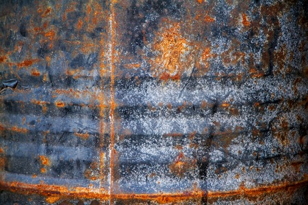 Rusty metal wall is a wall of an old oil tank.の写真素材