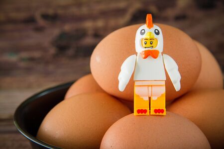 Lego Chicken Mascot on eggs. Legos are a popular line of plastic construction toys manufactured by The Lego Group, a company based in Denmark.の写真素材