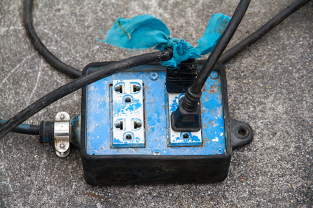 electrical cords connected to a power strip.