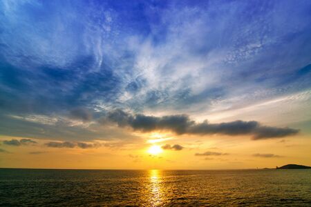 Sea evening on the calm wavesの写真素材