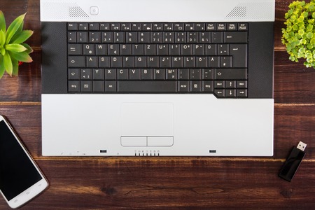 Notebook computer on the desk,USB flash drive stick,smartphoneの写真素材