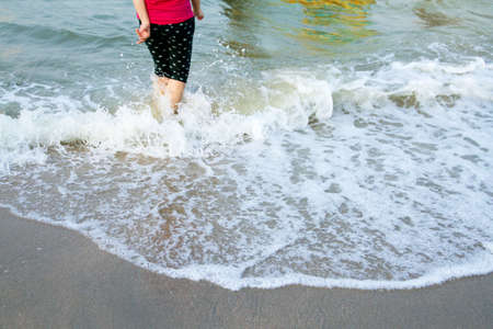 beach travel woman walking on sand beach.