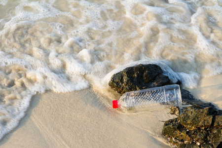 plastic bottle of water drink on the beach, Concept on the beach.の写真素材