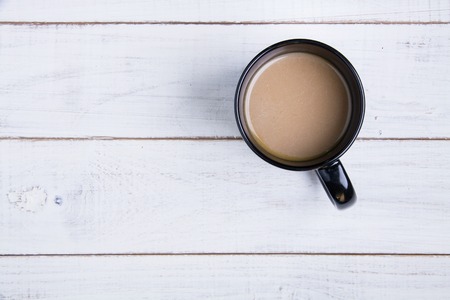 Coffee cup on the white wooden background.の写真素材