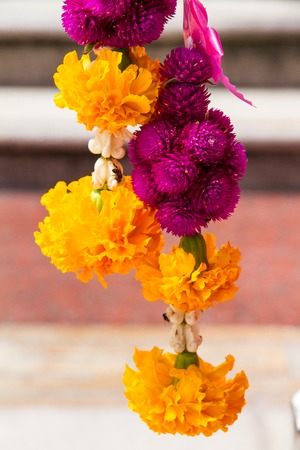 Traditional east asian Buddhist offering made with Marigold flowers, Thailand.の写真素材