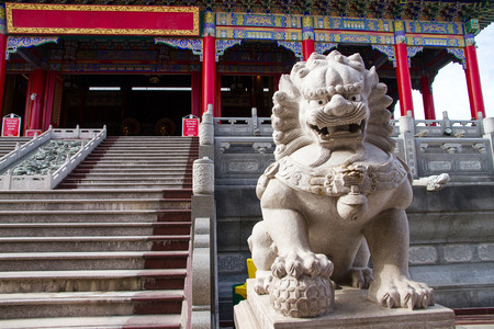 Lion statue with chinese style at that public chinese temple in thailand.の写真素材