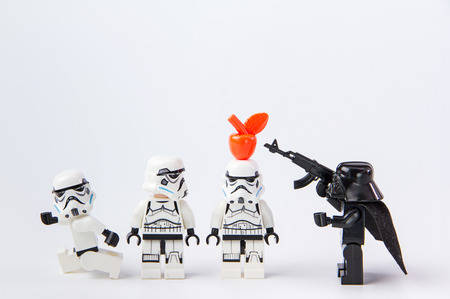 Nonthabure, Thailand - June, 28, 2016: Lego star wars test precision putting an apple on head.The lego Star Wars mini figures from movie series.Lego is an interlocking brick system collected around the world.のeditorial素材