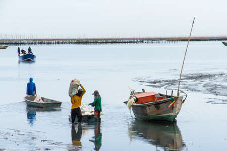 The fishermen returned to shore from fishing in the morningの写真素材