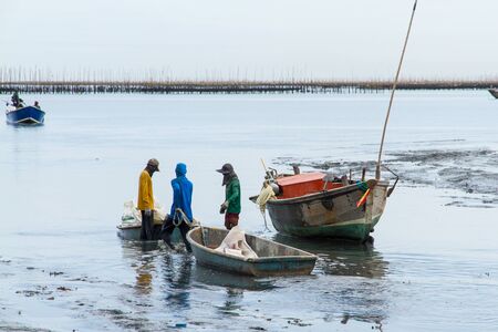 The fishermen returned to shore from fishing in the morningの写真素材