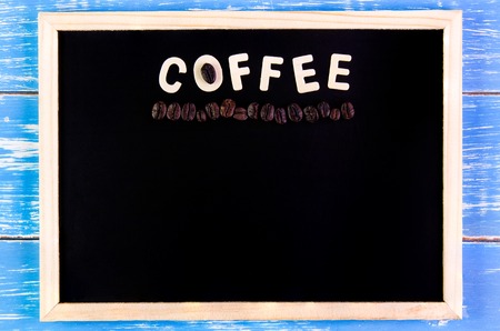 Wooden english alphabet coffee and coffee bean on the blackboardの写真素材