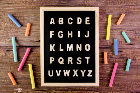 Wooden english alphabet A-Z on the blackboard.chalk on wooden tableの写真素材