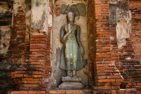 pieces of stones antique buddha and antique brick wall and pagoda of temple background fine art in Thailandの写真素材