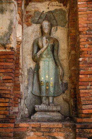 pieces of stones antique buddha and antique brick wall and pagoda of temple background fine art in Thailandの写真素材