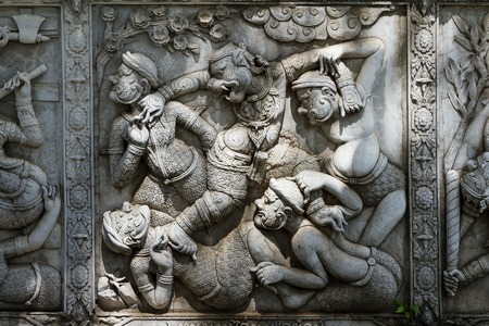 Masterpiece of traditional Thai style stucco art old about Ramayana story on temple decorative wall at Wat Panan Choeng temple, Ayutthaya, Thailand.の写真素材