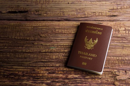 Thailand passport an official document issued by a government, certifying the holder's identity and citizenship and entitling them to travel under its protection to and from foreign countries.の写真素材