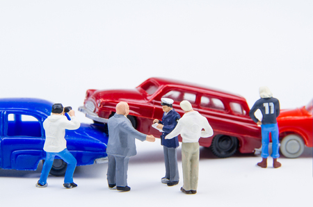 Miniature tiny toys car crash accident damaged.Accident on the road backgroundの写真素材