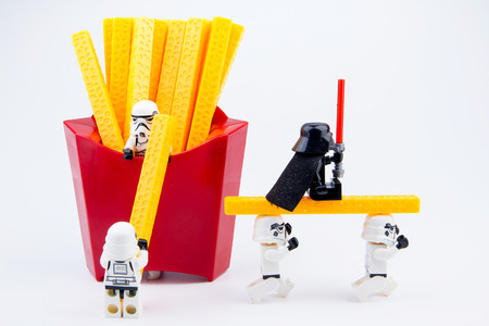 Nonthaburi, Thailand - November, 19, 2016: Lego star wars stormtrooper were carrying toys french fries plastic from red package.Lego is an interlocking brick system collected around the world.のeditorial素材