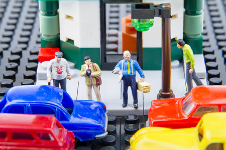 Miniature tiny toys people waiting to cross the road.の写真素材