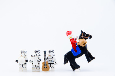Nonthaburi, Thailand - November, 26, 2016 : Lego Santa Claus ride a horse giving gifts to Lego star wars stormtrooper at Christmas.Theme Christmas day background.のeditorial素材