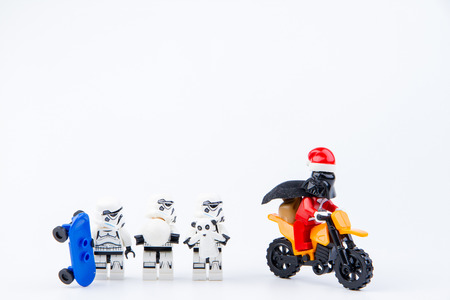 Nonthaburi, Thailand - November, 26, 2016 : Lego darth vader dressed as Santa Claus ride a motorcycle giving gifts to Lego star wars stormtrooper at Christmas.Theme Christmas day background.のeditorial素材