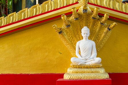 White buddha in Wat Sangkat Rattana Khiri on Khao Sakae Krang mountain in Uthai Thani, Thailandの写真素材