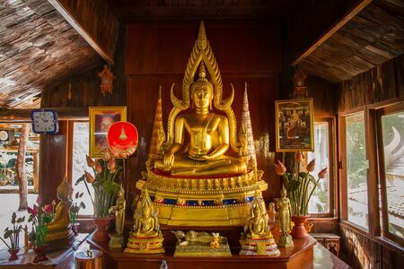 Uthai Thani, Thailand - December, 18, 2016 : Golden Buddha in Wat Tham Khao Wong, Thailand home style temple built in the middle of nature.Uthai Thani, Uthai Thani is small town in central Thailandのeditorial素材