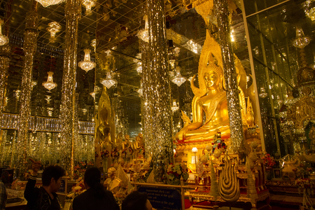 Uthai Thani, Thailand - December, 18, 2016 : Unidentified Tourist visit Golden Buddha statue in cathedral glass at the Wat Tha Sung Temple near Uthai Thani in Thailand.Uthai Thani is small town in central Thailandのeditorial素材