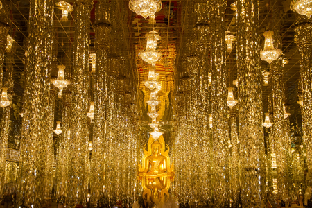 Uthai Thani, Thailand - December, 18, 2016 : Golden Buddha statue in cathedral glass at the Wat Tha Sung Temple near Uthai Thani in Thailand.Uthai Thani is small town in central Thailandのeditorial素材