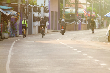 Uthai Thani, Thailand - December, 18, 2016 : Unidentified Cyclist cycling exercise on street in the morning at Uthai Thani.Uthai Thani is small town in central Thailand.のeditorial素材