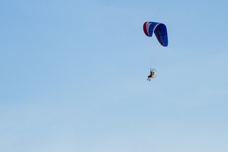 Paramotor, Parachute, Paraglide flying in the sunset skyの写真素材