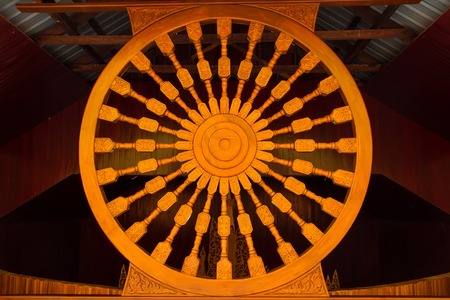 Wooden thammachak in Bodhgaya Stupa or Phuthakaya Pagoda at Sangklaburi, Kanchanaburi, Thailand.のeditorial素材