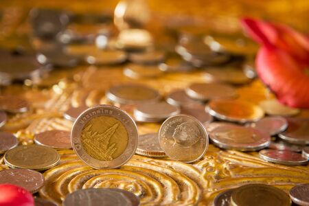 Baht coin on image of buddha's footprintの写真素材