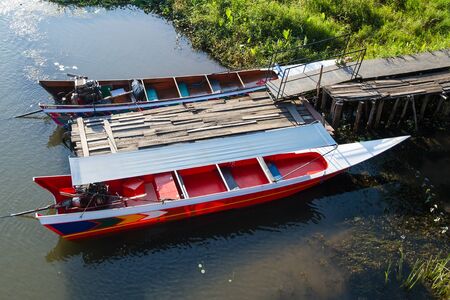 Thai speed boat on the water in the River Kwai at Kanchanaburi,Thailand.の写真素材