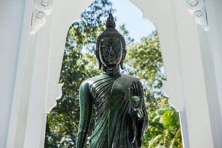 Black Buddha Statue in Wat Ta Kahnun temple, Kanjanaburi , Thailandの写真素材