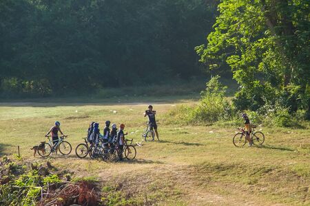 Kanchanaburi, Thailand - December, 25, 2016 : Unidentified The cyclists were gathered group take photos with smart phone in the morning light at Kanchanaburi,Thailandのeditorial素材