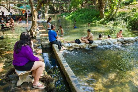Kanchanaburi, Thailand - December, 25, 2016 : Unidentified Tourists soak hot springs at Hin Dat Hot Spring , Kanchanaburi , Thailand.のeditorial素材