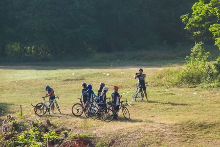 Kanchanaburi, Thailand - December, 25, 2016 : Unidentified The cyclists were gathered group take photos with smart phone in the morning light at Kanchanaburi,Thailandのeditorial素材